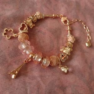 Rose gold snake chain charm bracelet with eiffel tower and flowers